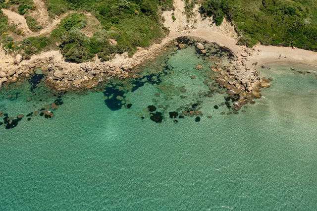 Aerial view of the turquoise cove and beach near Leventes