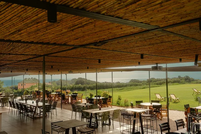 The covered dining area at Leventes looking out over the garden