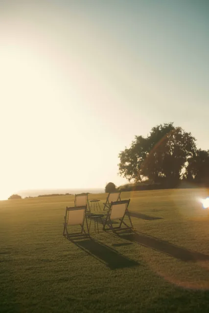 Golden afternoon light across the Leventes garden lawn