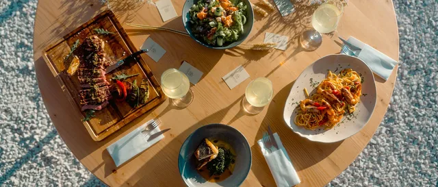 A full table spread of Mediterranean dishes at Leventes