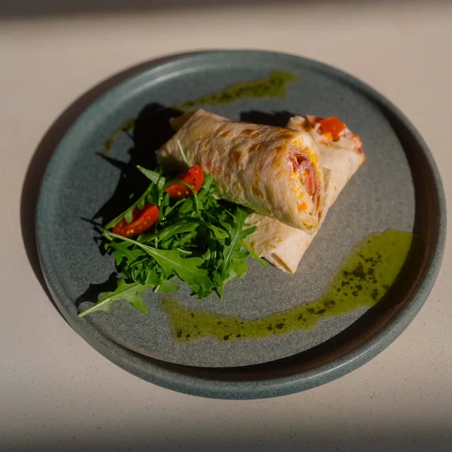 Breakfast burrito with rocket and cherry tomatoes