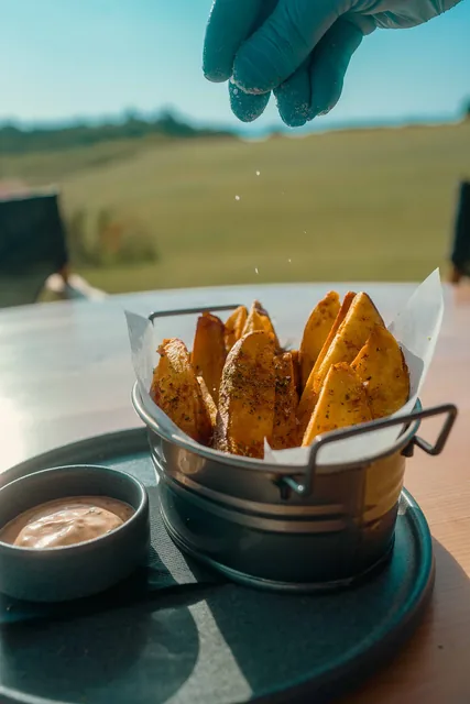 Double-cooked potatoes with sour cream, finished with salt