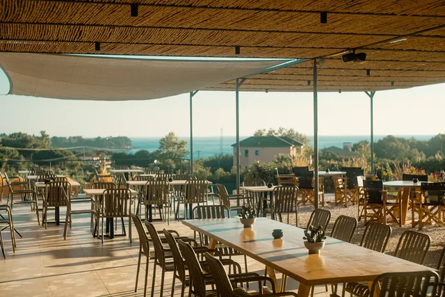 Warm evening light across the terrace tables at Leventes